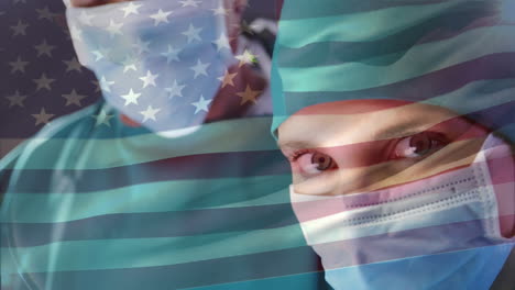 animation of flag of usa waving over surgeons in operating theatre