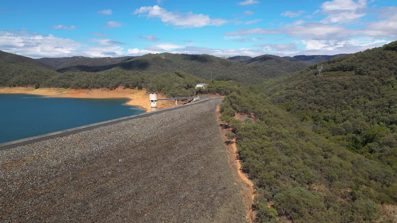 Rising aerial views over the Blowering Dam and Reservoir, New South Wales alpine region.