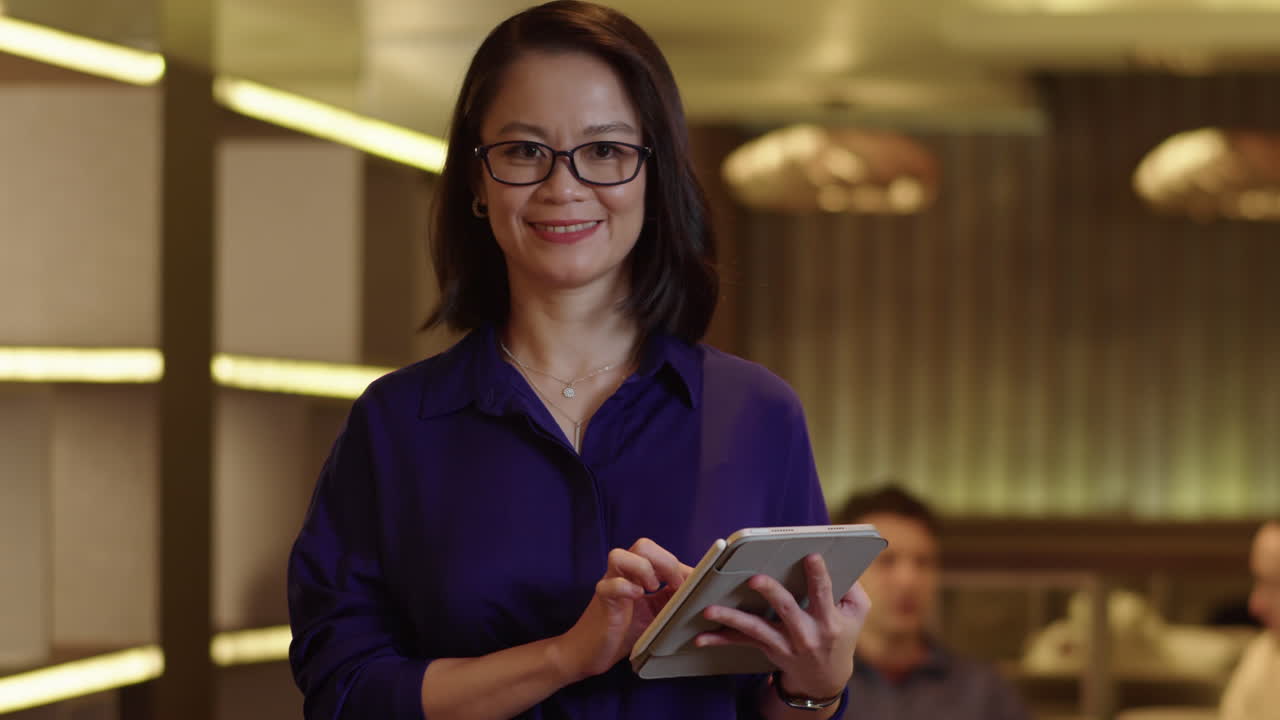 Asian Businesswoman Working on Tablet Computer