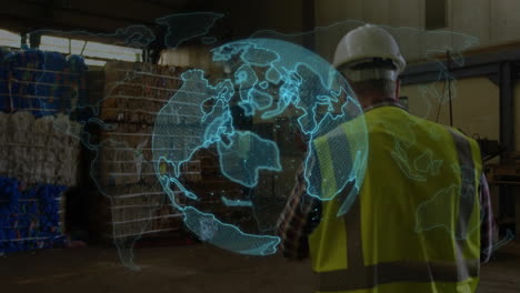 worker in safety gear in warehouse with rotating globe animation over