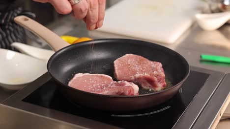 chef seasoning pork chops