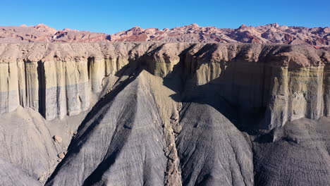 drone shot of pastel layered rock formations in utah