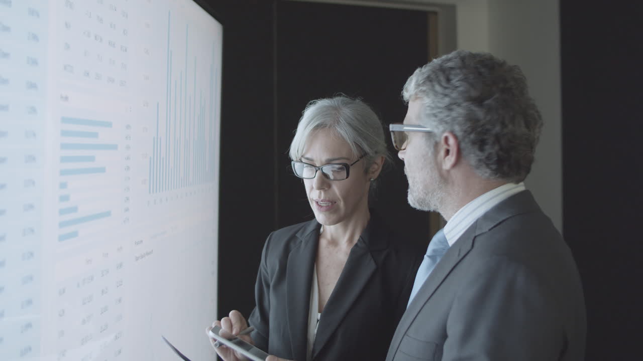 Female finance expert explaining stock market statistics