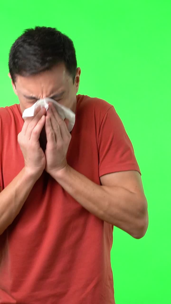 Man Sneezing and Sick on Green Screen