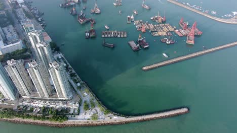 Hong-Kong-Butterfly-beach-area-skyscrapers-and-Ocean-walk,-low-angle-aerial-view