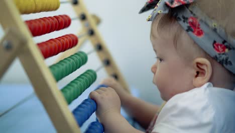 child plays with a multi-colored toy 9