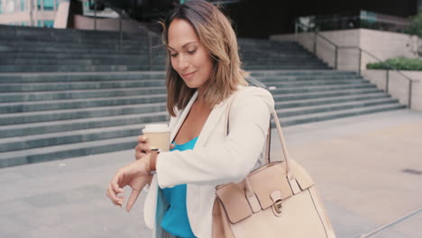 beautiful mixed race business woman walking through city