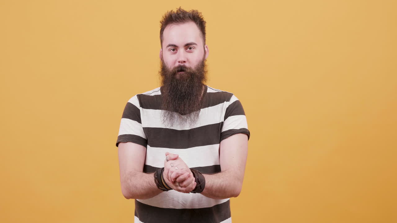 Man with beard on yellow background