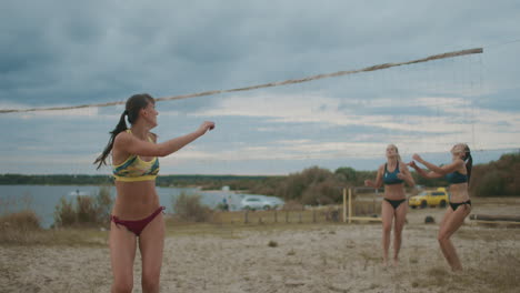 beach volleyball at summer vacation slow motion shot of slender sportswomen playing healthy lifestyle and sport activities