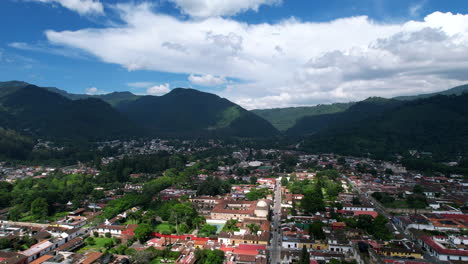 Aerial-view-of-Antigua-Guatemala-by-DJI-air2s-drone-flying-upwards-above-the-city,-revealing-beautiful-architecture-and-landscape-of-the-city