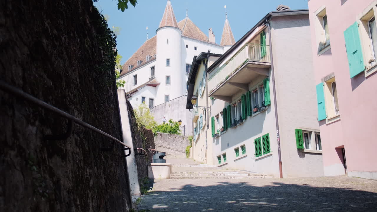 Nyon castle at midday, view from an old street in canton of Vaud, Switzerland, medium shot