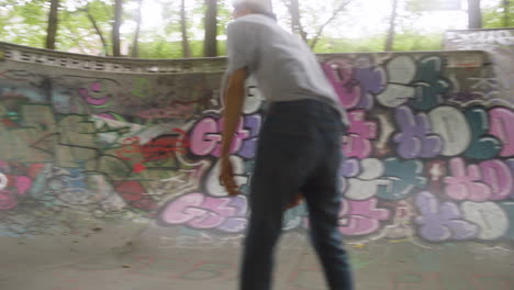 caucasian boy skateboarding in the park.