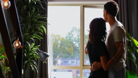 side view of young asian couple embracing each other at home 4k