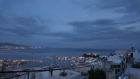 evening panorama of a coastal city harbor