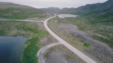 Panning-while-moving-sideways-drone-shot-next-to-lakes-and-hills