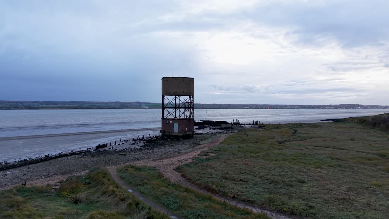 East Tilbury radar tower aerial view low angle approaching the River Thames marshland landmark