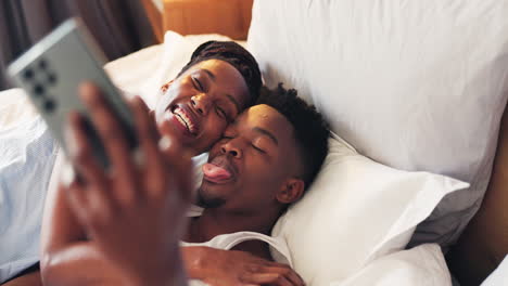 Selfie,-bed-and-African-couple-in-bedroom-together