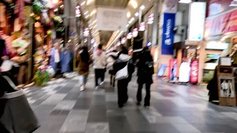 crowded street market with shops and tourists