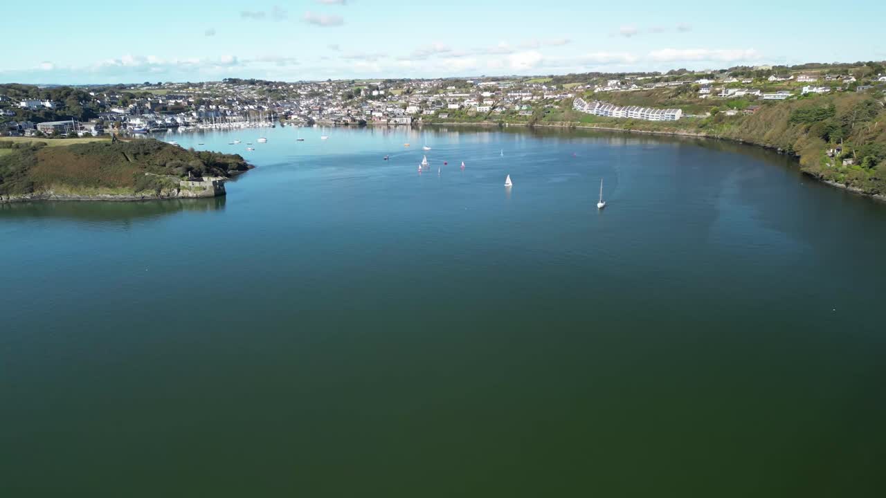 Aerial View of a Coastal Town with Sailboats