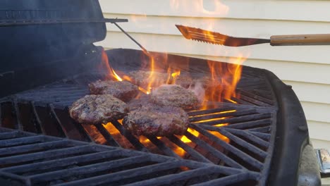 flames well grilling- cooking hamburgers