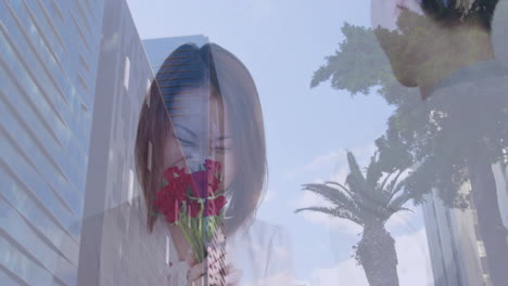 smelling red roses, woman in cityscape with palm tree and animation overlay