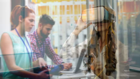using virtual reality headset, woman interacting with digital interface over office workers