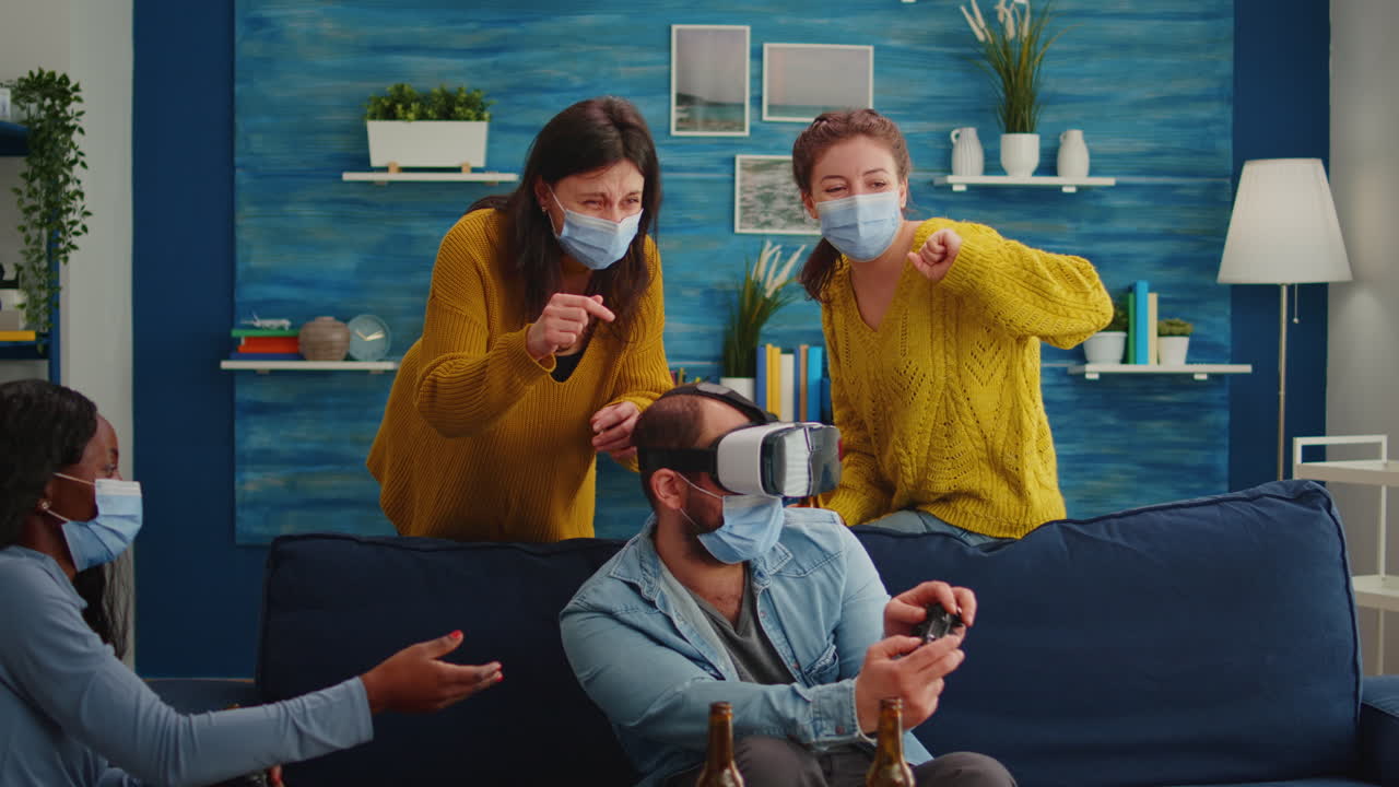 Diverse people playing video games using vr headset goggles