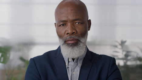 portrait senior african american businessman executive looking serious arms crossed confident middle aged entrepreneur in office slow motion corporate manager