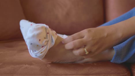 woman sitting on couch with feet up