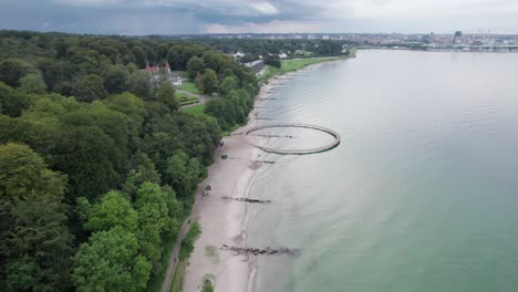 Round-Bridge-on-the-Coast-of-Aarhus,-Denmark-Close-to-Marselisborg-Palace,-Aerial-View