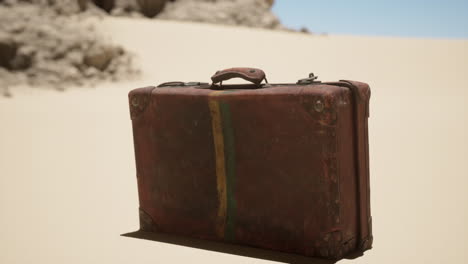 vintage suitcase abandoned in the desert