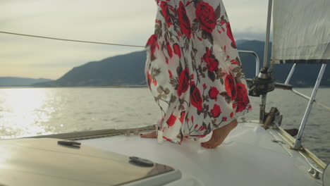 woman in a floral dress on a sailing yacht