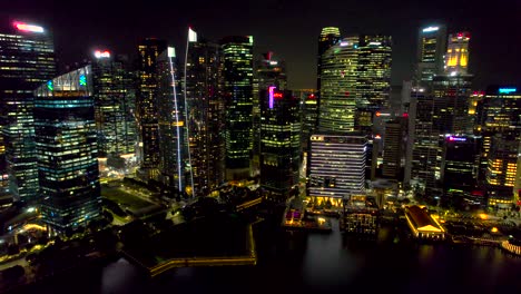 singapore, malaysia, skyline at night. drone pullback shot