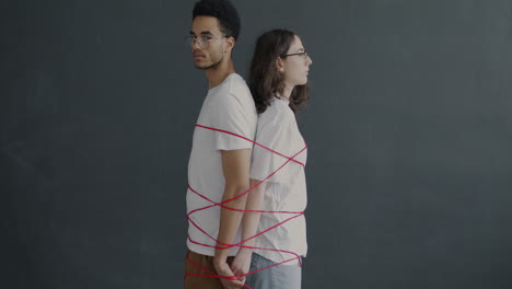 Couple Tied Together with Red String