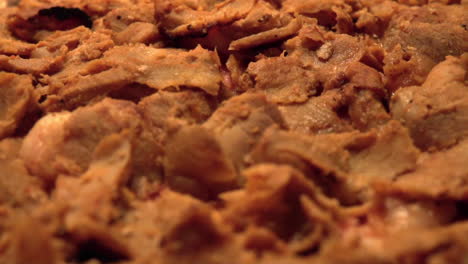 close up footage of a delicious swedish pizza. topped with kebab meat. slow motion footage
