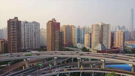 china sunny day shanghai cityscape traffic round road junction aerial panorama 4k