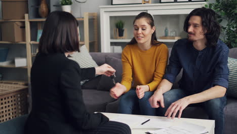 real estate closing - happy couple receiving keys