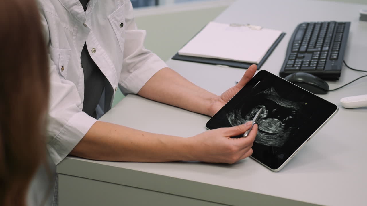 Physician explaining image on device
