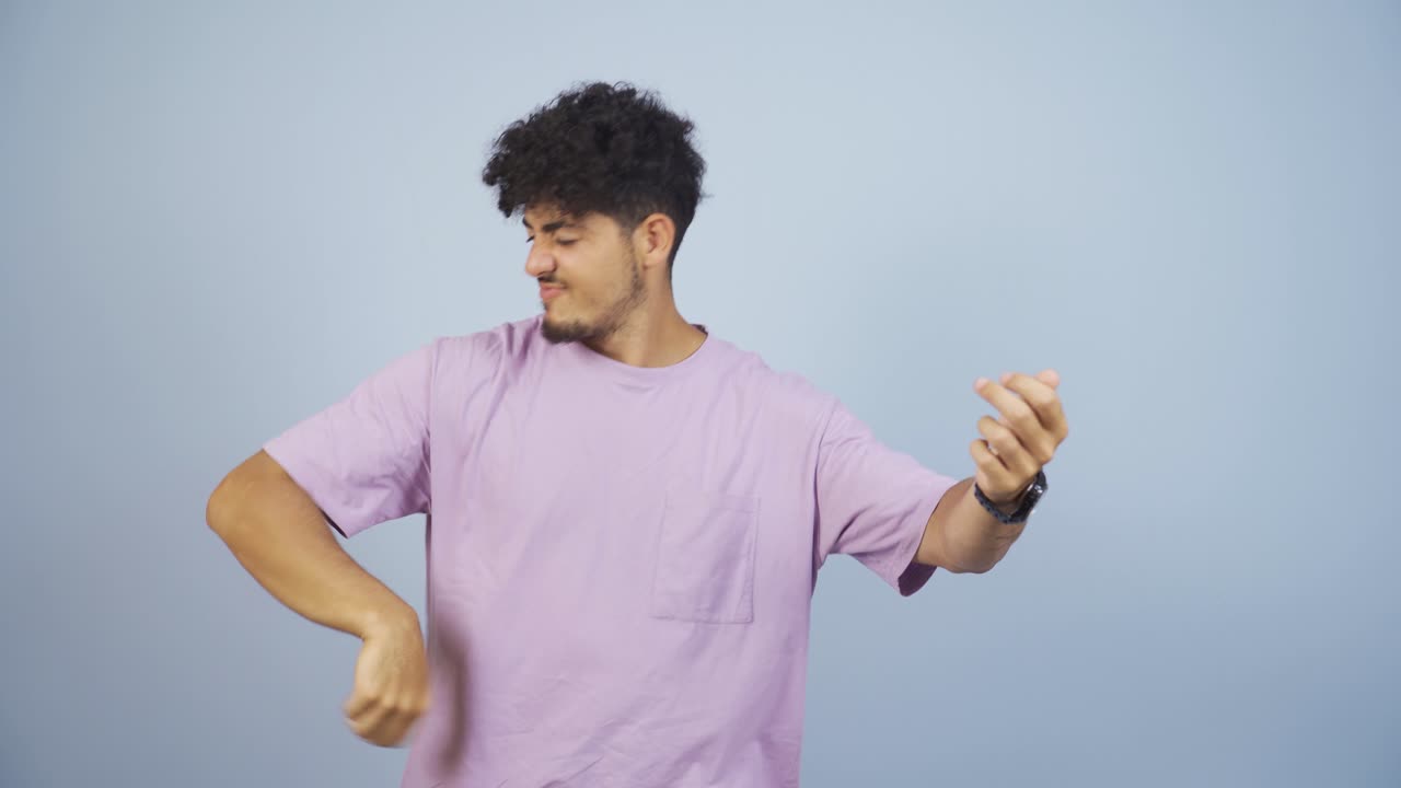 Man doing rocker sign and dancing.