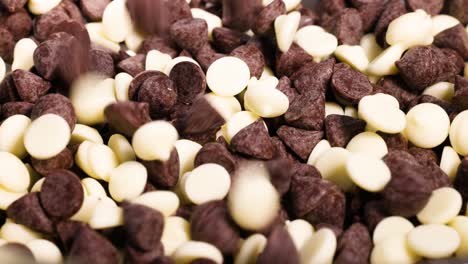 dark and white chocolate chips being mixed together