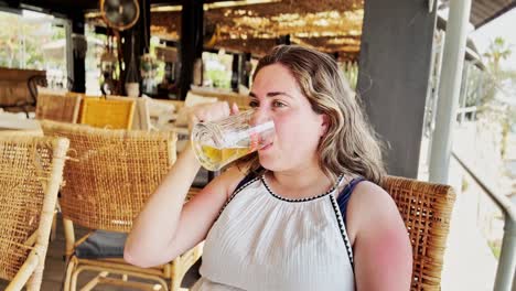 greek harbor relaxation: tourist at outdoor restaurant