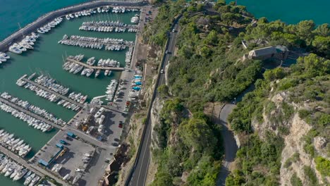 drone shot above a road near a port