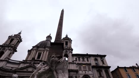 a view of fontana dei quattro fiumi fountain in the piazza navona in rome, italy. low angle shot