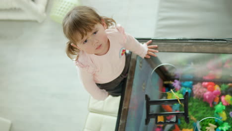 Little-Girl-Frowning-Expressing-Anger-and-Disagreement-Looking-at-a-Camera-and-Smashing-Table-With-Hands