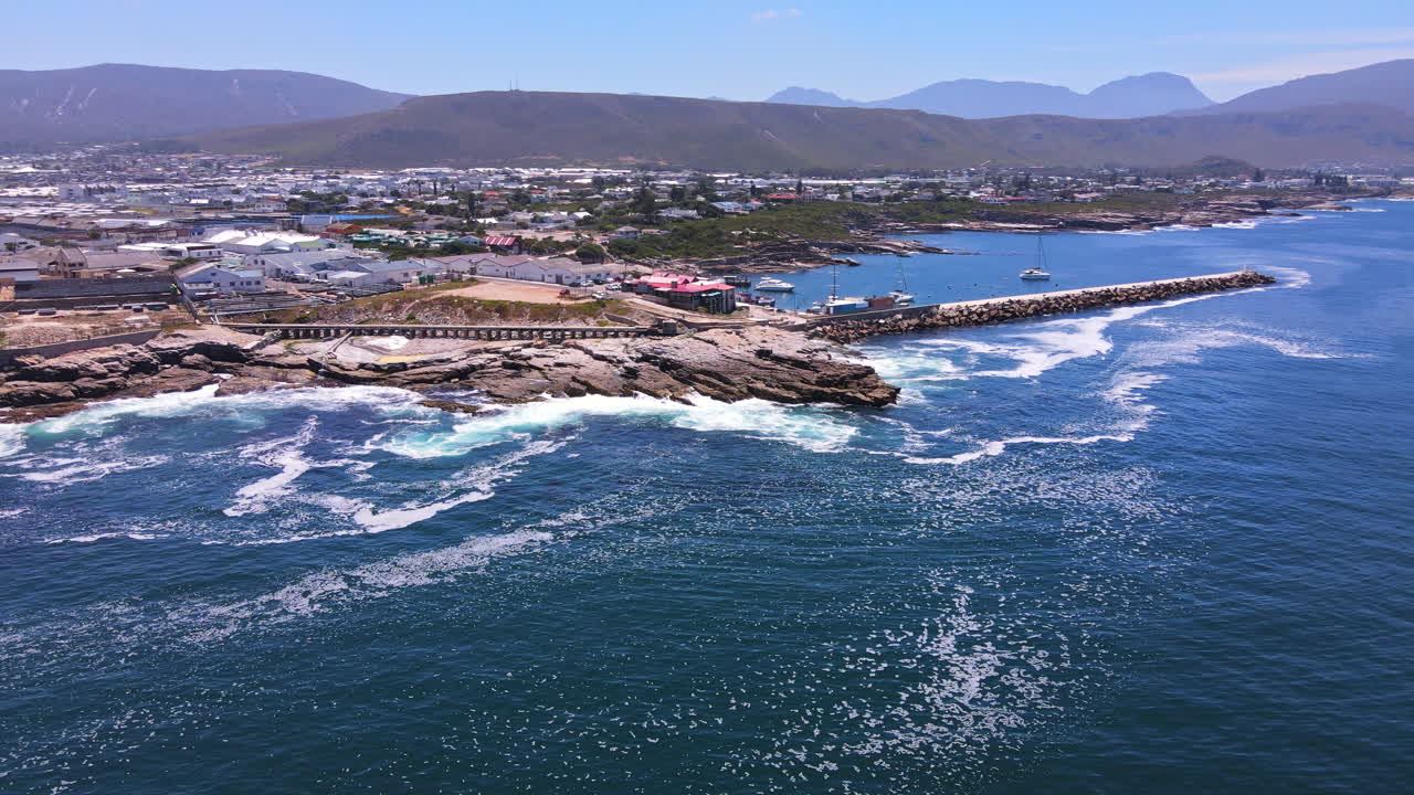 Aerial view of Hermanus New Harbour and pier protected by dolosse