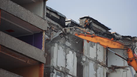 demolition building after nature disease. urban excavator destruction demolishing.