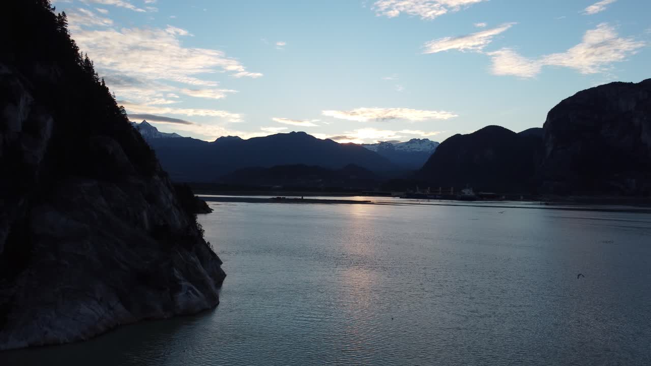 A drone view of sunrise in the town of Squamish from above the Howe Sound