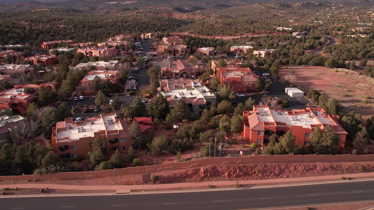 Sedona Arizona USA, Revealing Drone Shot of Apartment Buildings by Freeway and Landscape
