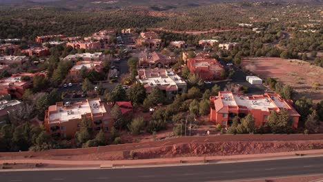 sedona arizona usa, revealing drone shot of apartment buildings by freeway and landscape