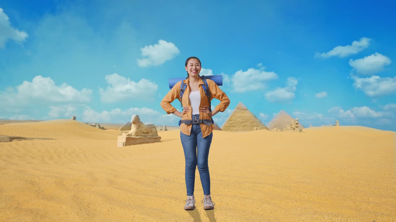 Full Body Of Asian Female Hiker With Mountaineering Backpack Smiling And Posing Arms Akimbo While Traveling In Pyramid Of Giza